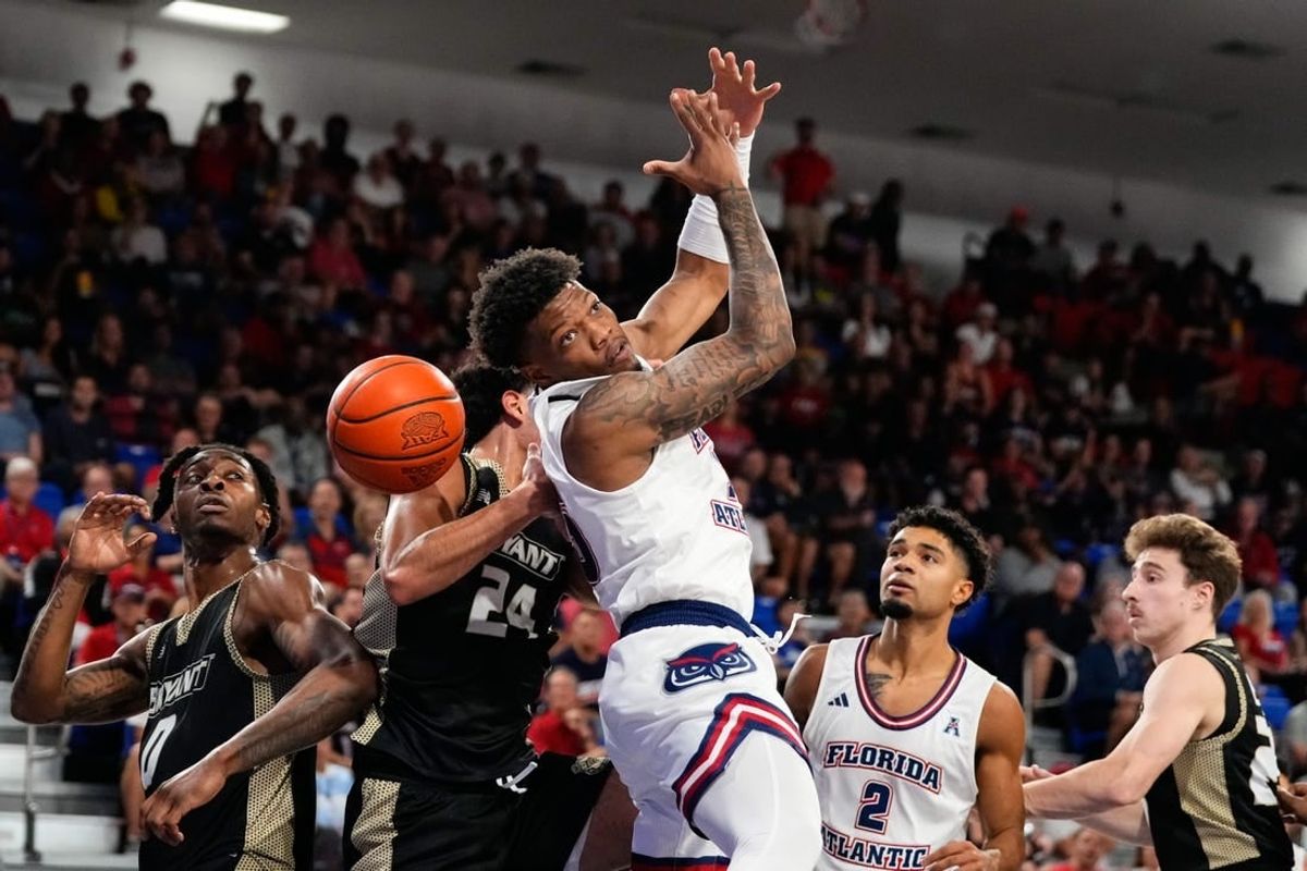 Nov 18, 2023; Boca Raton, Florida, USA; Florida Atlantic Owls guard Alijah Martin (15) attempts to grab a rebound against the Bryant University Bulldogs during the first half at Eleanor R. Baldwin Arena.