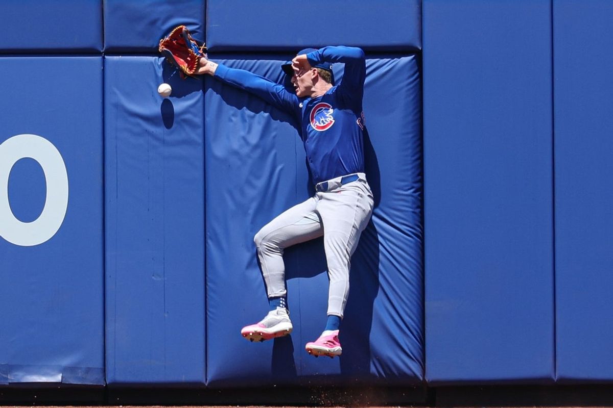 May 11, 2025; New York City, New York, USA; Chicago Cubs center fielder Pete Crow-Armstrong (4) can not catch a ball hit by New York Mets catcher Luis Torrens (not pictured) during the second inning at Citi Field. Mandatory Credit: Vincent Carchietta-Imagn Images