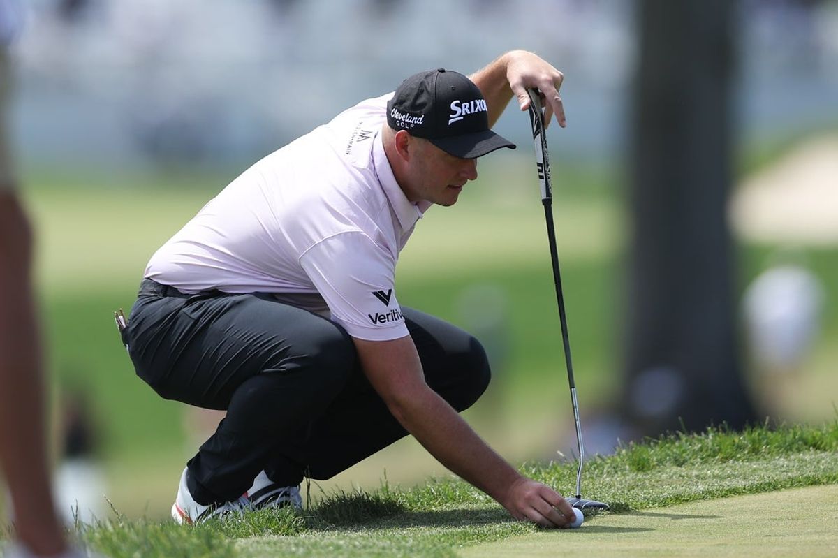 May 11, 2025; Philadelphia, Pennsylvania, USA; Sepp Straka lines up a putt on the first hole during the final round of the Truist Championship golf tournament. Mandatory Credit: Bill Streicher-Imagn Images
