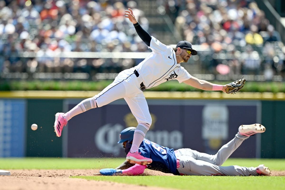 May 11, 2025; Detroit, Michigan, USA; Texas Rangers right fielder Adolis García (53) steals  second base successfully after the throw to Detroit Tigers shortstop Zach McKinstry (39) gets into center field in the third inning at Comerica Park. Mandatory Credit: Lon Horwedel-Imagn Images