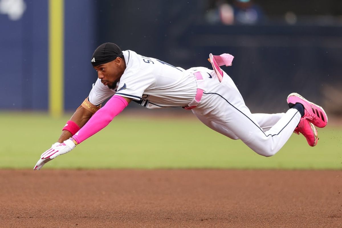 May 11, 2025; Tampa, Florida, USA; Tampa Bay Rays left fielder Chandler Simpson (14) steals second base against the Milwaukee Brewers in the first inning at George M. Steinbrenner Field. Mandatory Credit: Nathan Ray Seebeck-Imagn Images