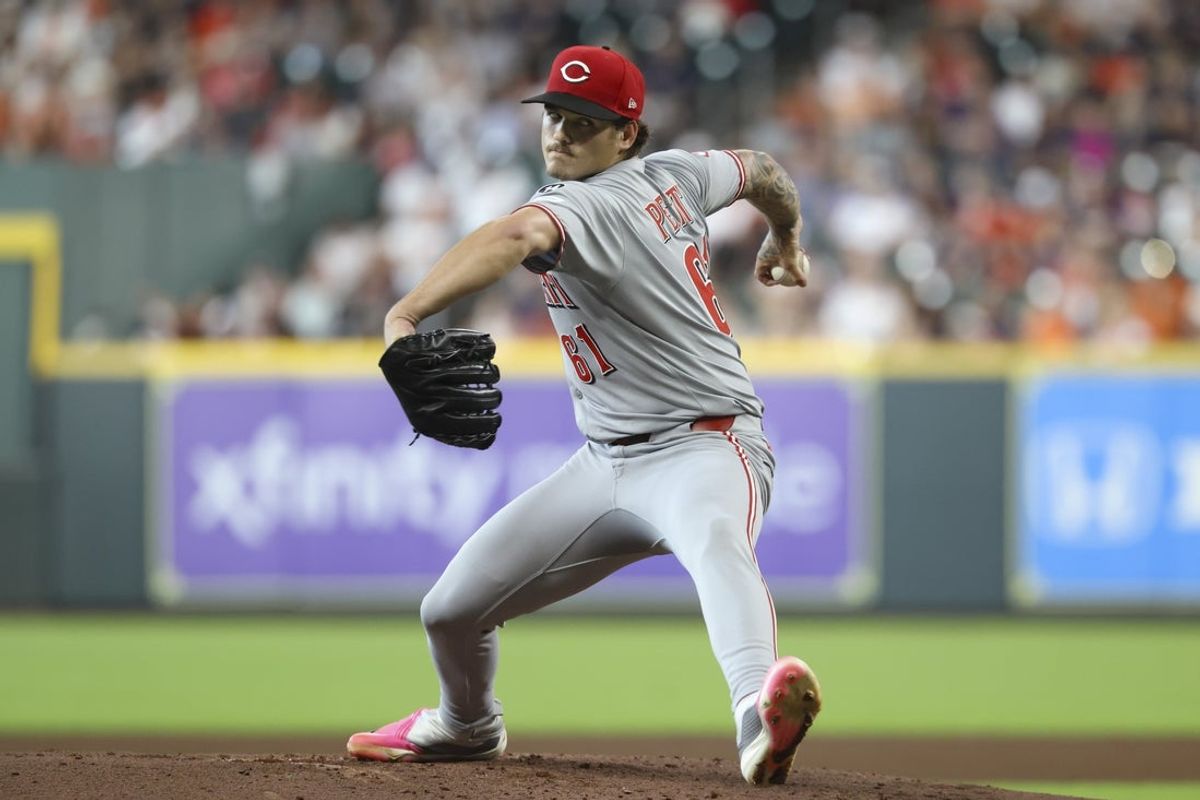 May 11, 2025; Houston, Texas, USA; Cincinnati Reds starting pitcher Chase Petty (61) delivers a pitch during the second inning against the Houston Astros at Daikin Park. Mandatory Credit: Troy Taormina-Imagn Images