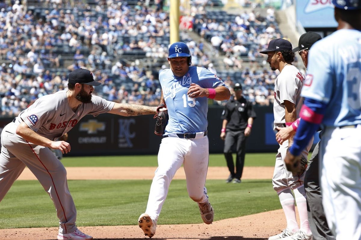 May 11, 2025; Kansas City, Missouri, USA; Kansas City Royals catcher Luke Maile (15) gets picked off at first base at Kauffman Stadium. Mandatory Credit: Gary Rohman-Imagn Images