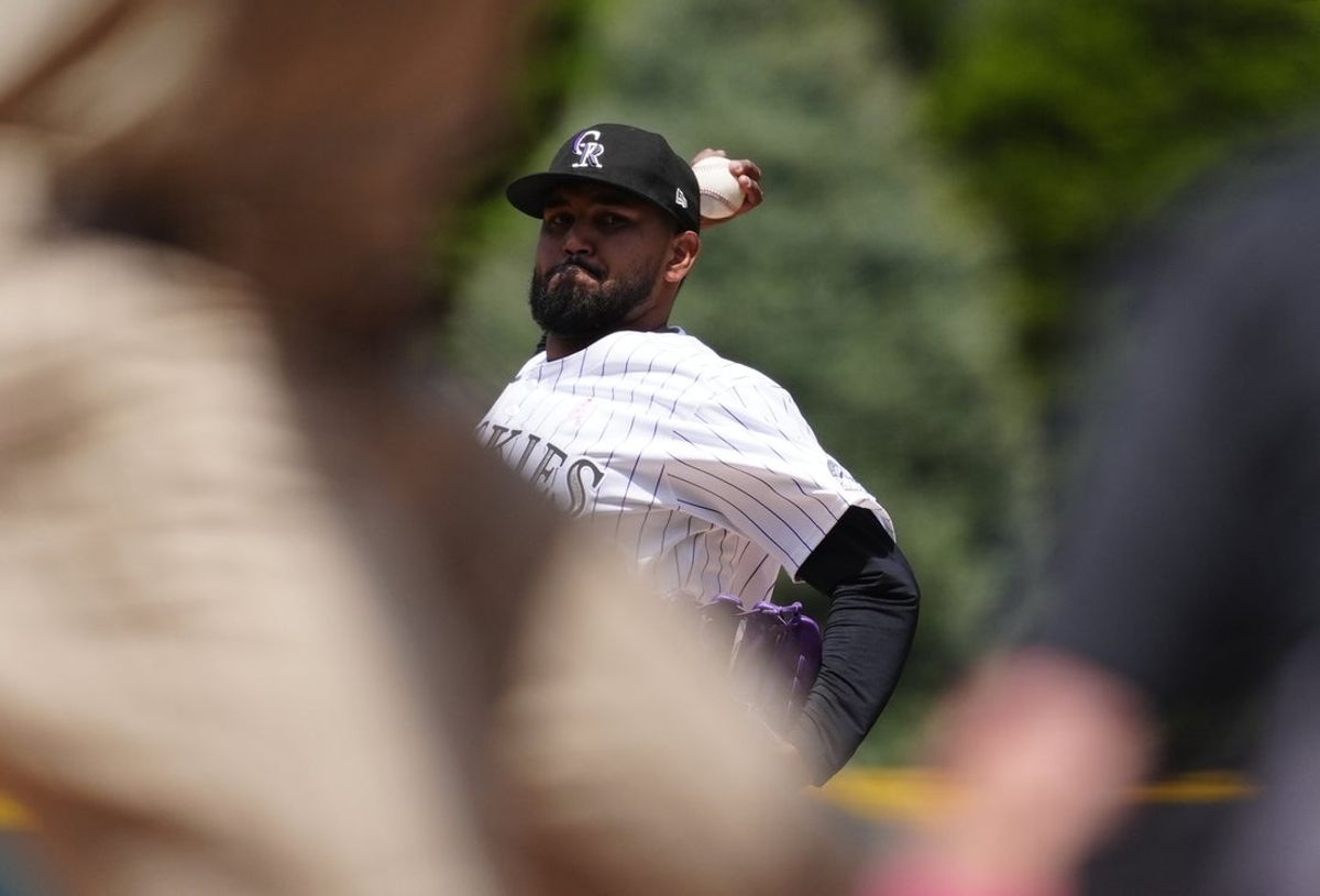 May 11, 2025; Denver, Colorado, USA; Colorado Rockies starting pitcher German Marquez (48) delivers a pitch in the first inning against the San Diego Padres at Coors Field. Mandatory Credit: Ron Chenoy-Imagn Images