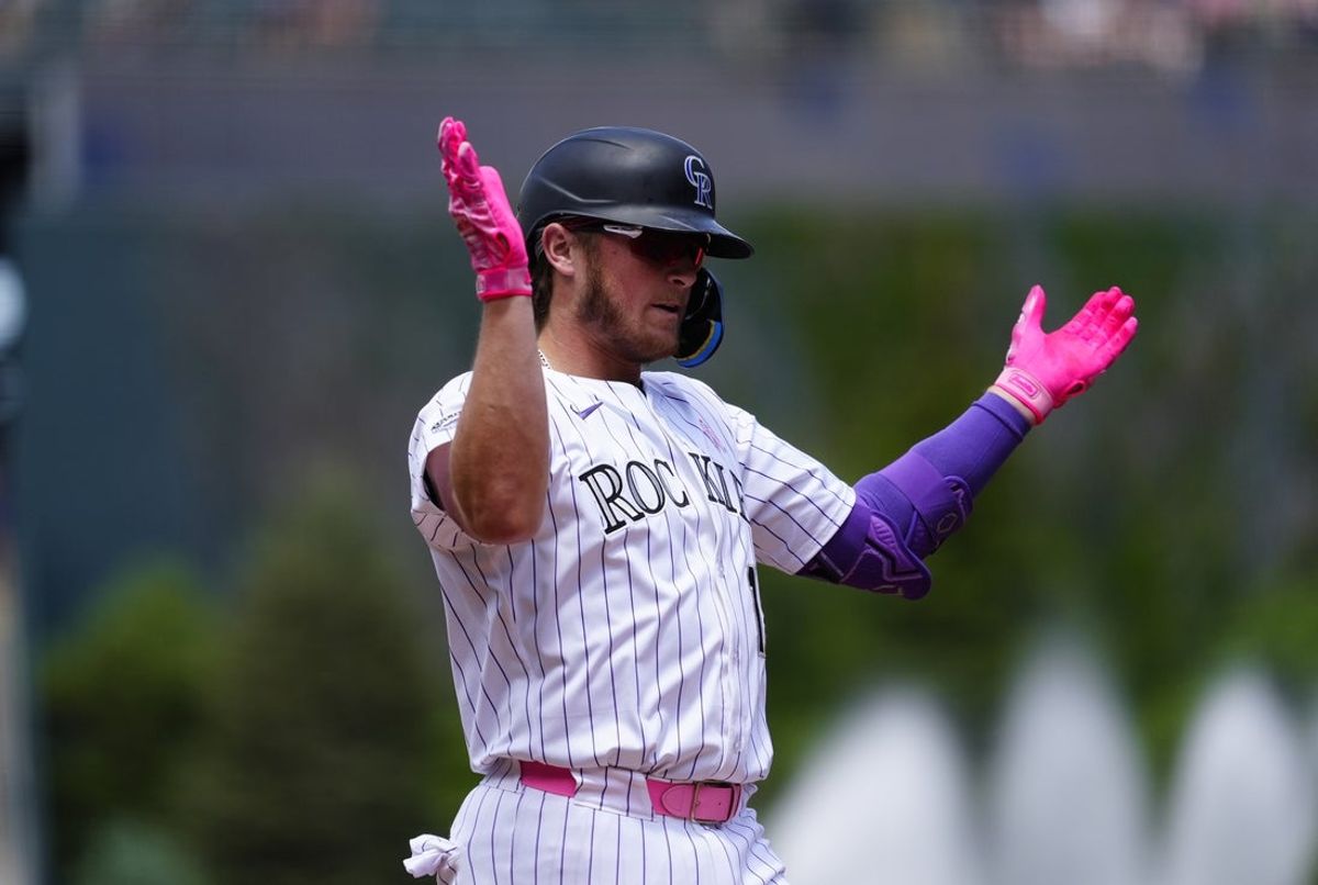 May 11, 2025; Denver, Colorado, USA; Colorado Rockies catcher Hunter Goodman (15) celebrates his three run home run in the first inning against the San Diego Padres at Coors Field. Mandatory Credit: Ron Chenoy-Imagn Images