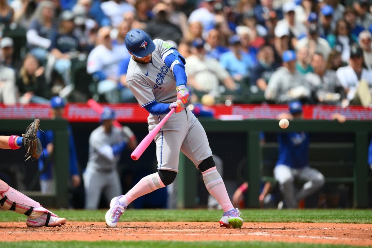 May 11, 2025; Seattle, Washington, USA; Toronto Blue Jays designated hitter George Springer (4) hits a 3-run home run against the Seattle Mariners during the fifth inning at T-Mobile Park. Mandatory Credit: Steven Bisig-Imagn Images