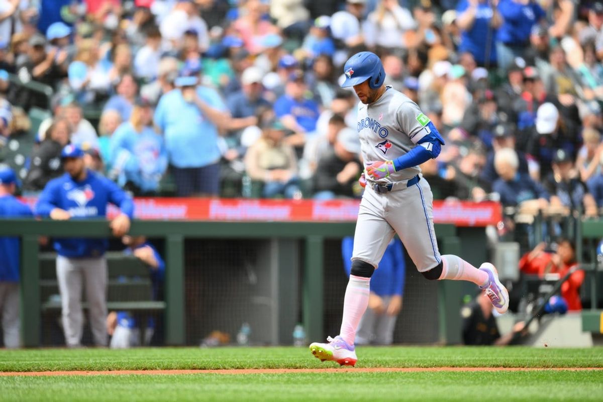 May 11, 2025; Seattle, Washington, USA; Toronto Blue Jays designated hitter George Springer (4) runs the bases after hitting a 3-run home run against the Seattle Mariners during the fifth inning at T-Mobile Park. Mandatory Credit: Steven Bisig-Imagn Images