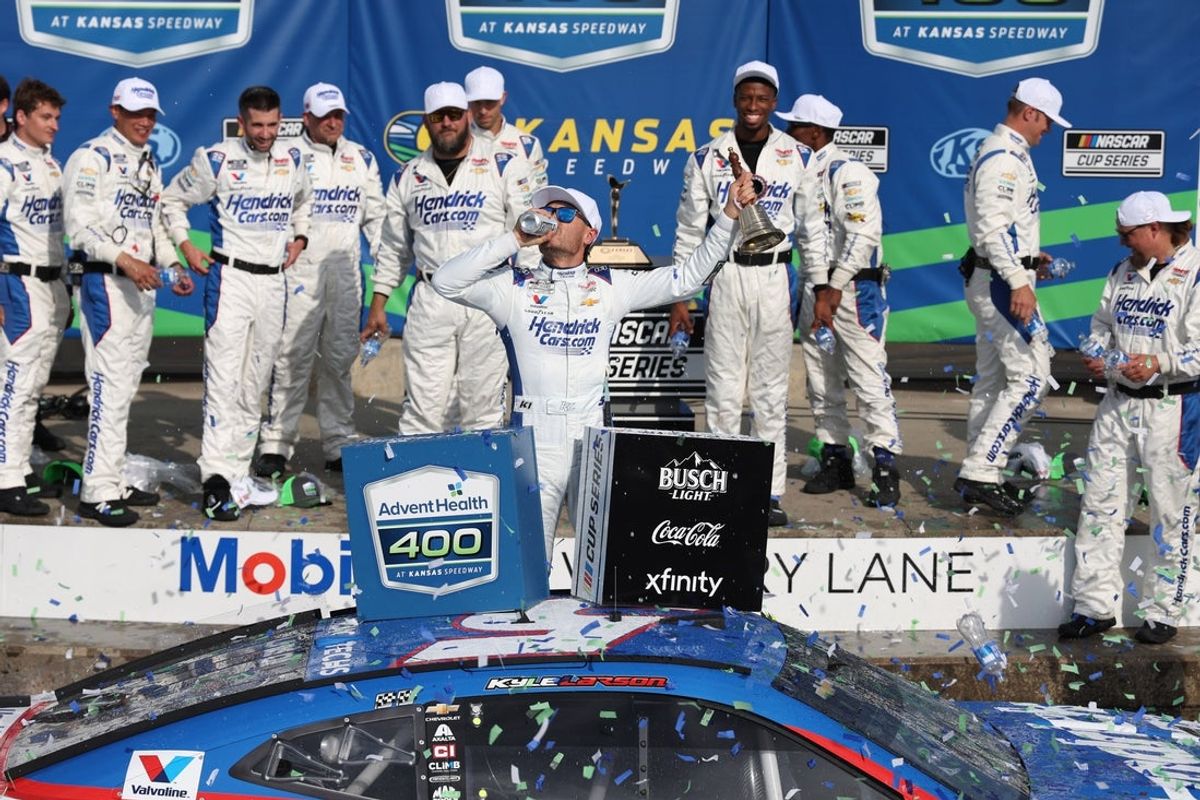 May 11, 2025; Kansas City, Kansas, USA; NASCAR Cup Series driver Kyle Larson (5) celebrates a win at the AdventHealth 400 at Kansas Speedway. Mandatory Credit: Scott Sewell-Imagn Images