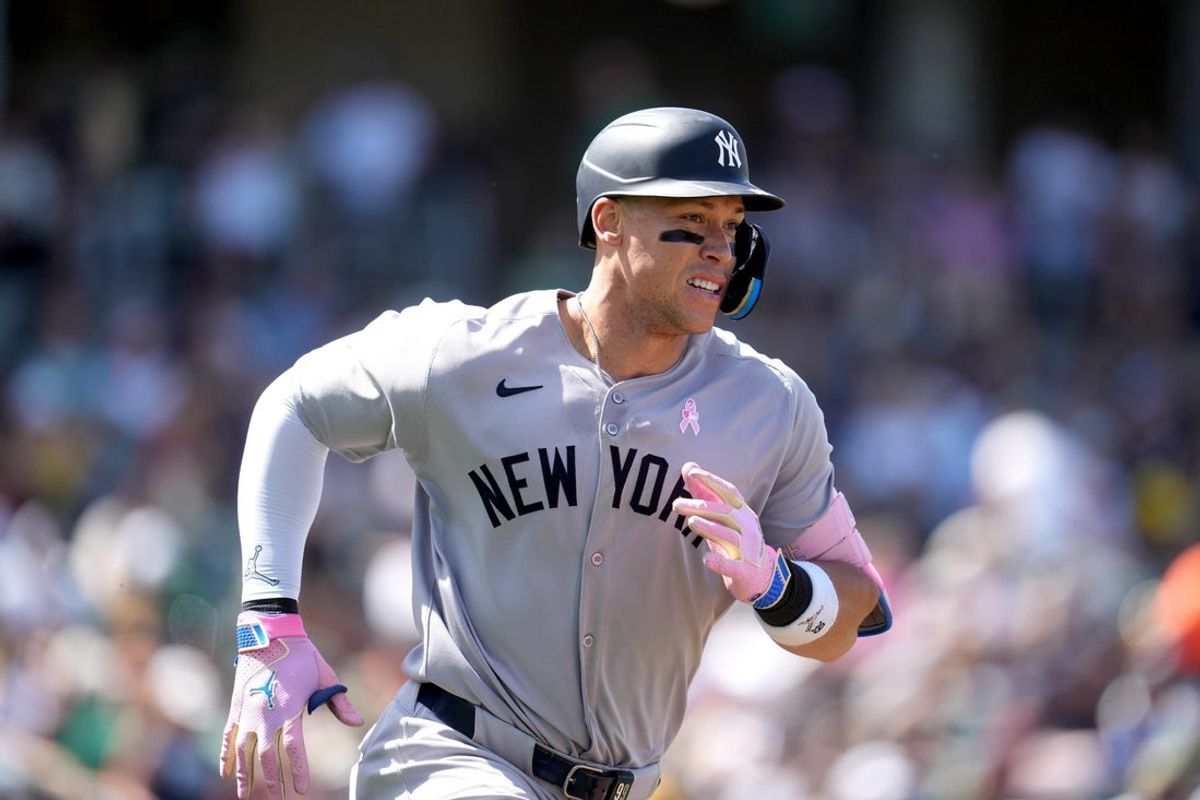 May 11, 2025; West Sacramento, California, USA; New York Yankees right fielder Aaron Judge (99) runs toward first base after hitting a single against the Athletics in the seventh inning at Sutter Health Park. Mandatory Credit: Cary Edmondson-Imagn Images