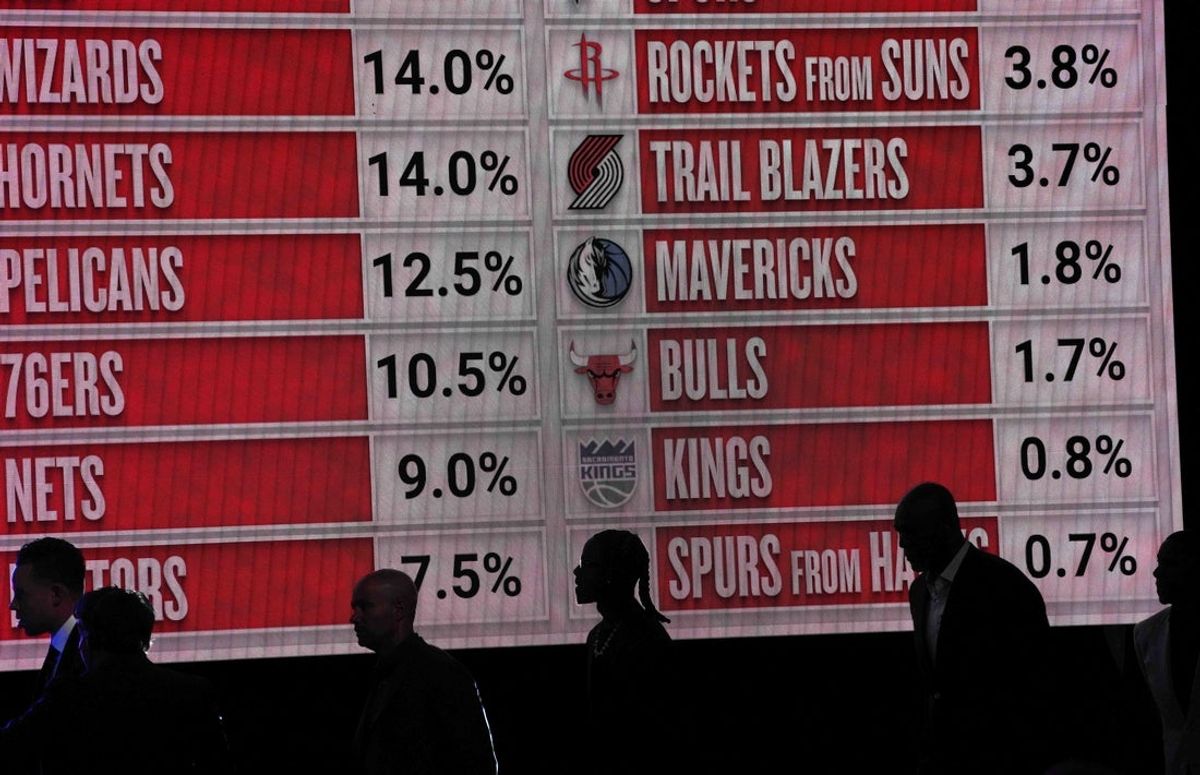 May 12, 2025; Chicago, Illinois, US; Representitives of the NBA teams walk onto the stage during the 2025 NBA Draft Lottery at McCormick Place. Mandatory Credit: David Banks-Imagn Images