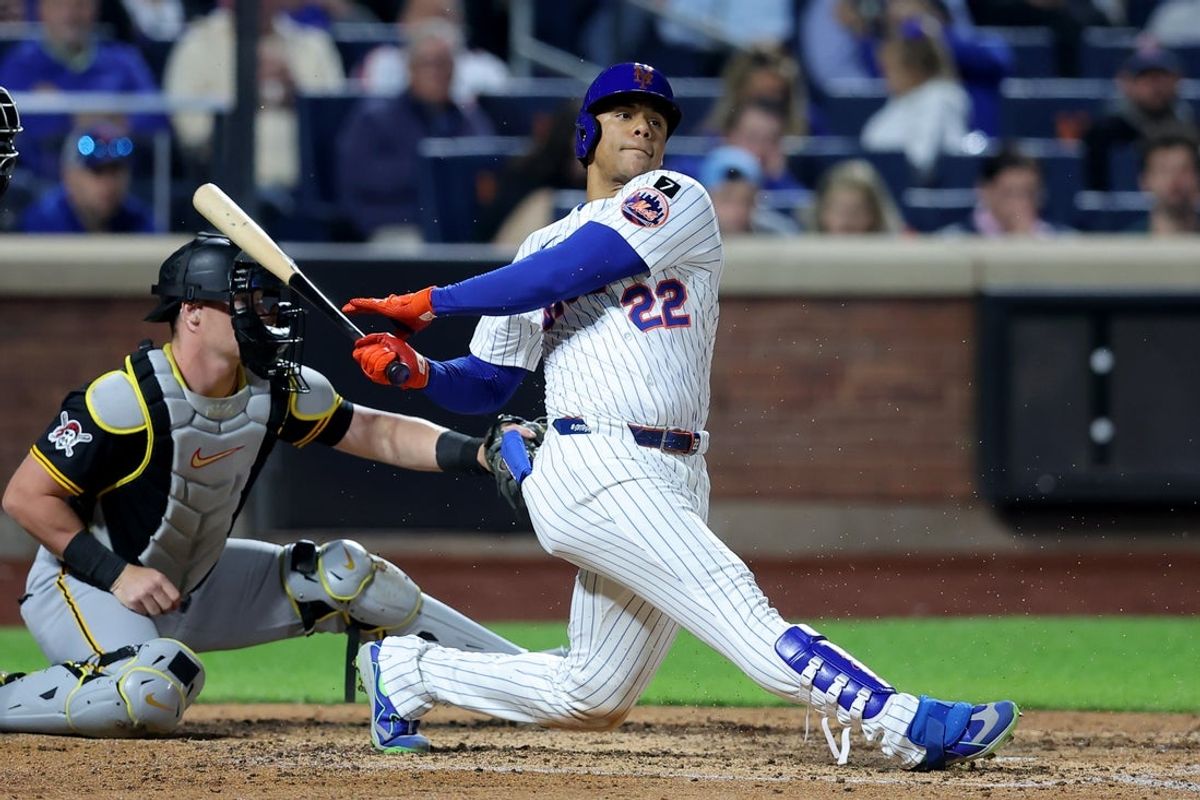 May 12, 2025; New York City, New York, USA; New York Mets right fielder Juan Soto (22) follows through on an RBI groundout during the seventh inning against the Pittsburgh Pirates at Citi Field. Mandatory Credit: Brad Penner-Imagn Images