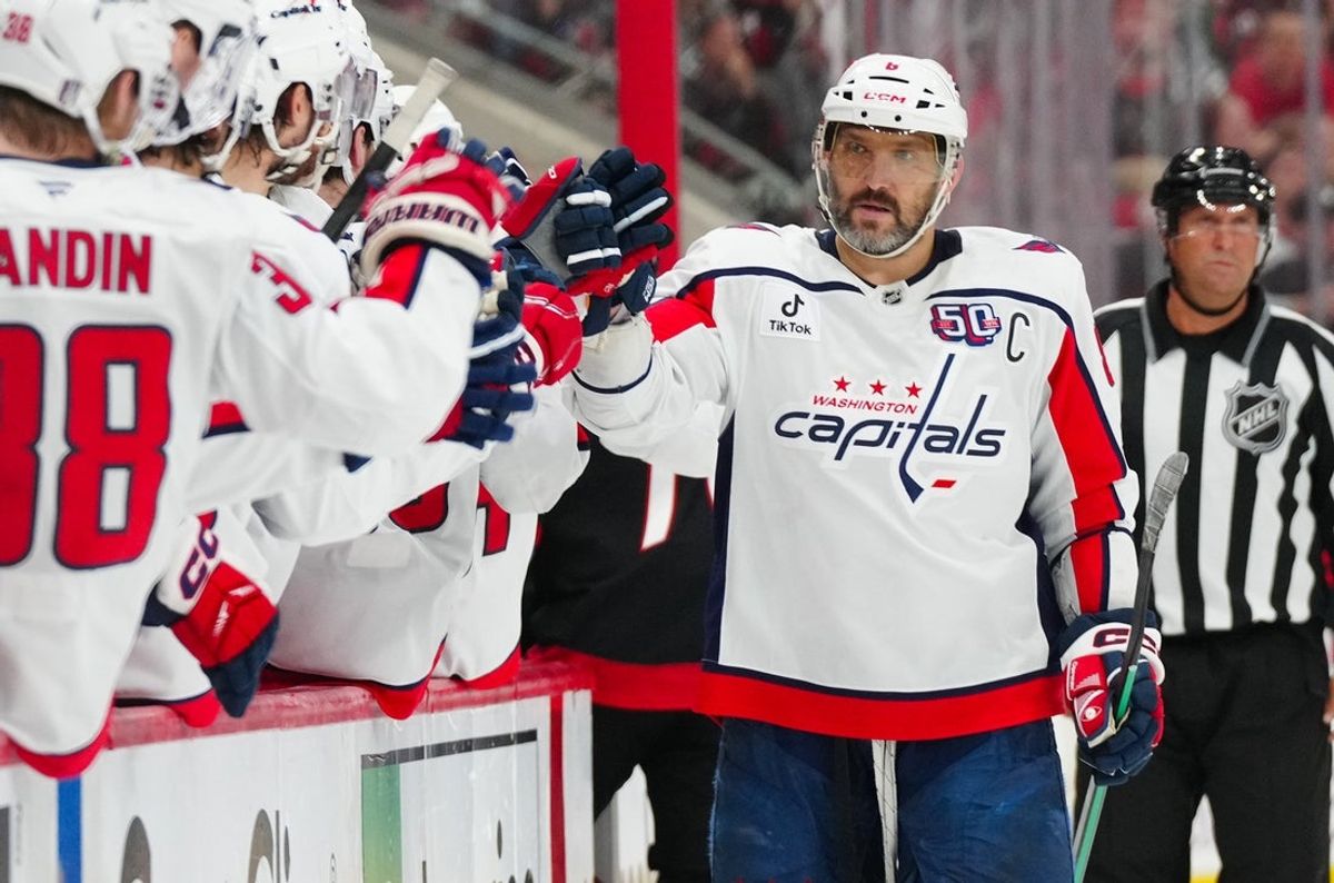 May 12, 2025; Raleigh, North Carolina, USA; Washington Capitals left wing Alex Ovechkin (8) scores a goal against the Carolina Hurricanes during the third period in game four of the second round of the 2025 Stanley Cup Playoffs at Lenovo Center. Mandatory Credit: James Guillory-Imagn Images