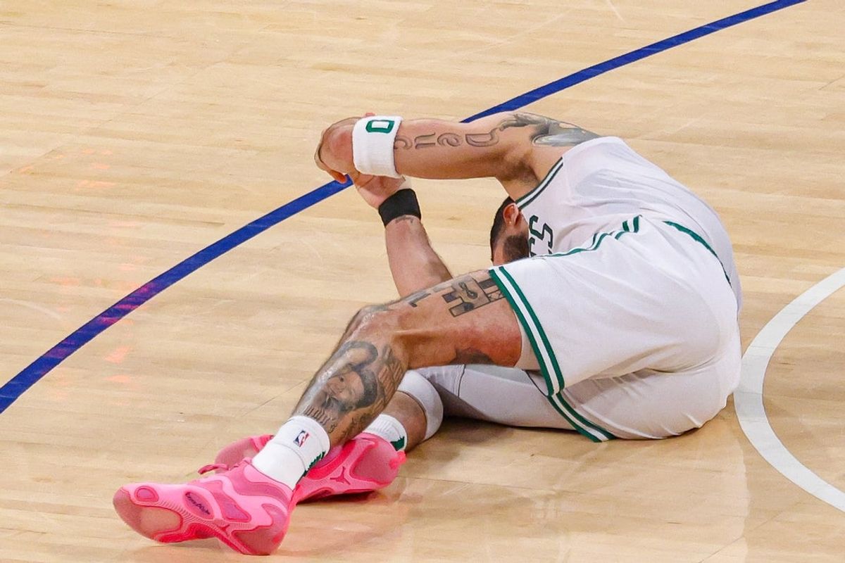 May 12, 2025; New York, New York, USA; Boston Celtics forward Jayson Tatum (0) reacts on the court after an injury in the second half during game four of the second round for the 2025 NBA Playoffs against the New York Knicks at Madison Square Garden. Tatum would leave the game with an injury after this play. Mandatory Credit: Vincent Carchietta-Imagn Images