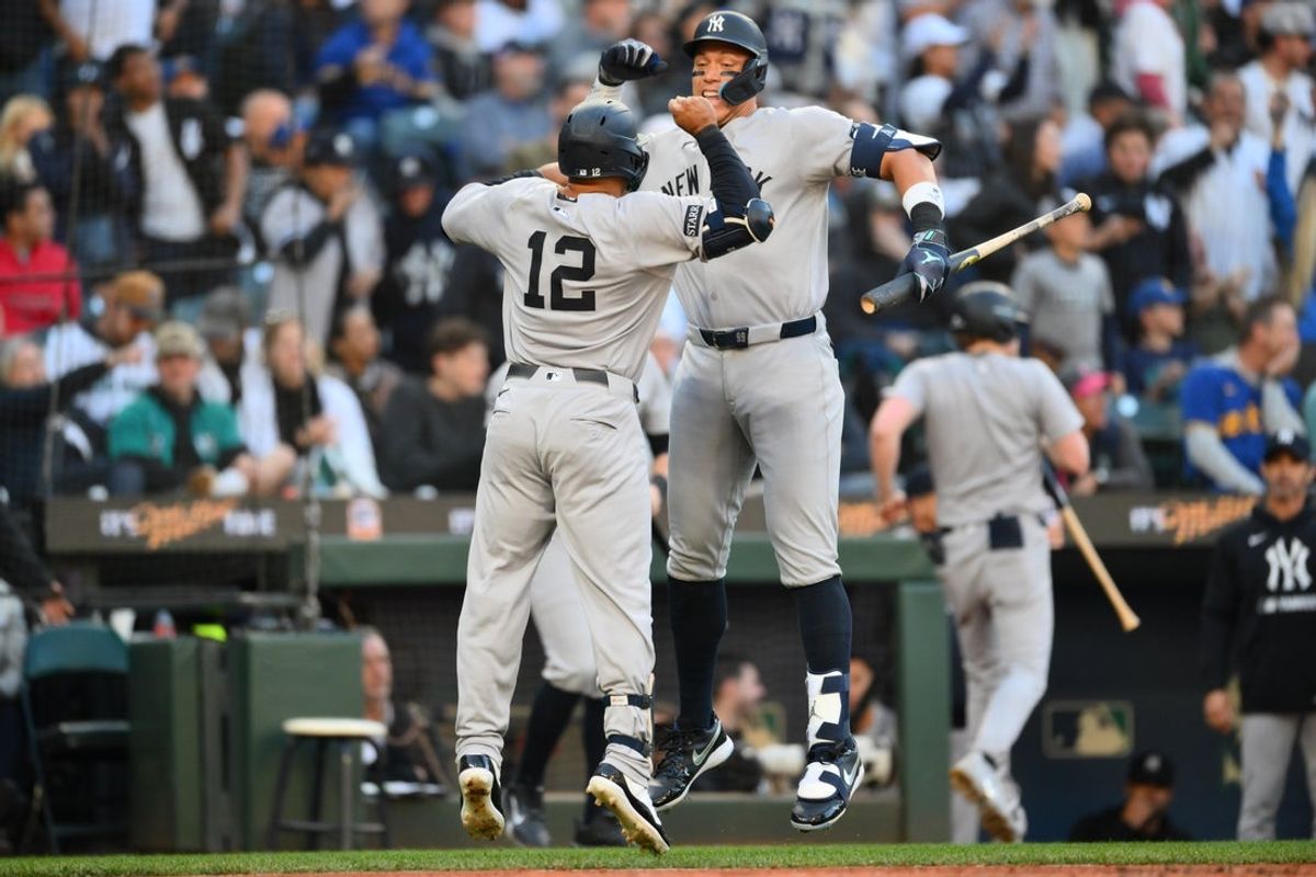 May 12, 2025; Seattle, Washington, USA; New York Yankees right fielder Aaron Judge (99) and center fielder Trent Grisham (12) celebrate after Grisham hit a home run against the Seattle Mariners during the third inning at T-Mobile Park. Mandatory Credit: Steven Bisig-Imagn Images
