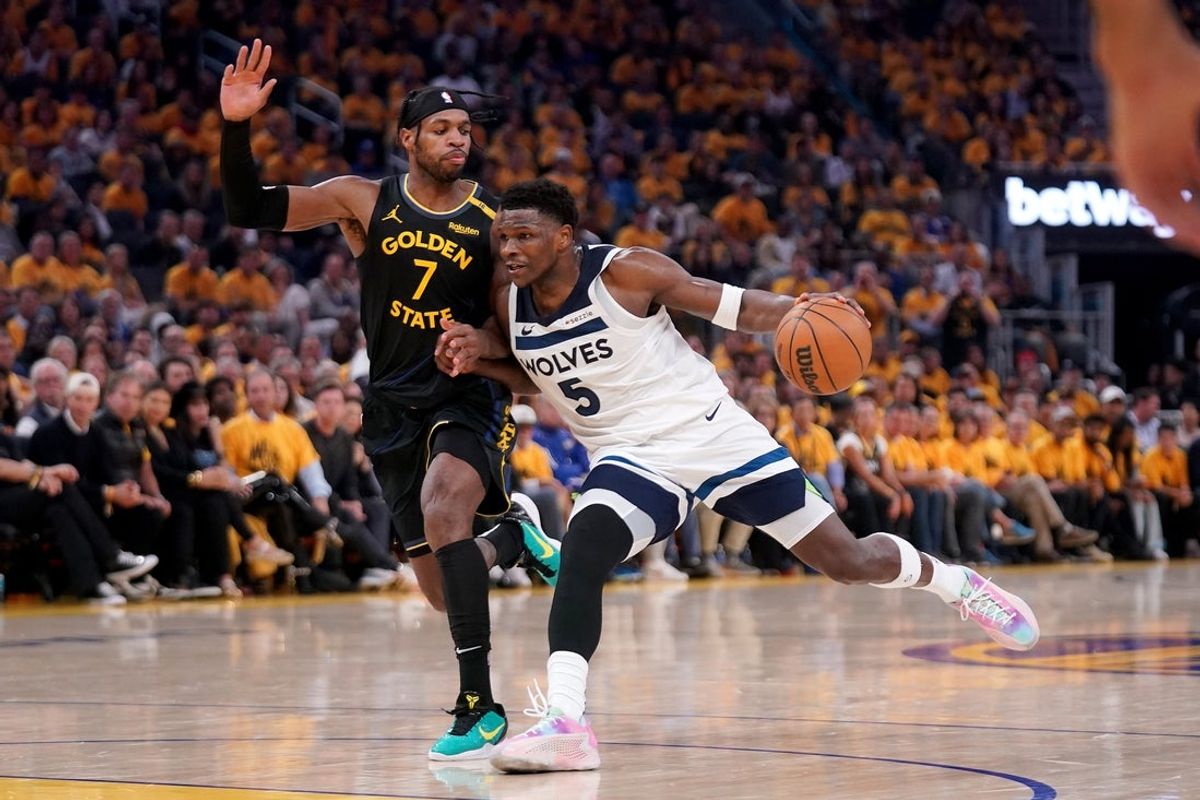 May 12, 2025; San Francisco, California, USA; Minnesota Timberwolves guard Anthony Edwards (5) dribbles the ball next to Golden State Warriors guard Buddy Hield (7) in the first quarter during game four of the second round for the 2025 NBA Playoffs at Chase Center. Mandatory Credit: Cary Edmondson-Imagn Images