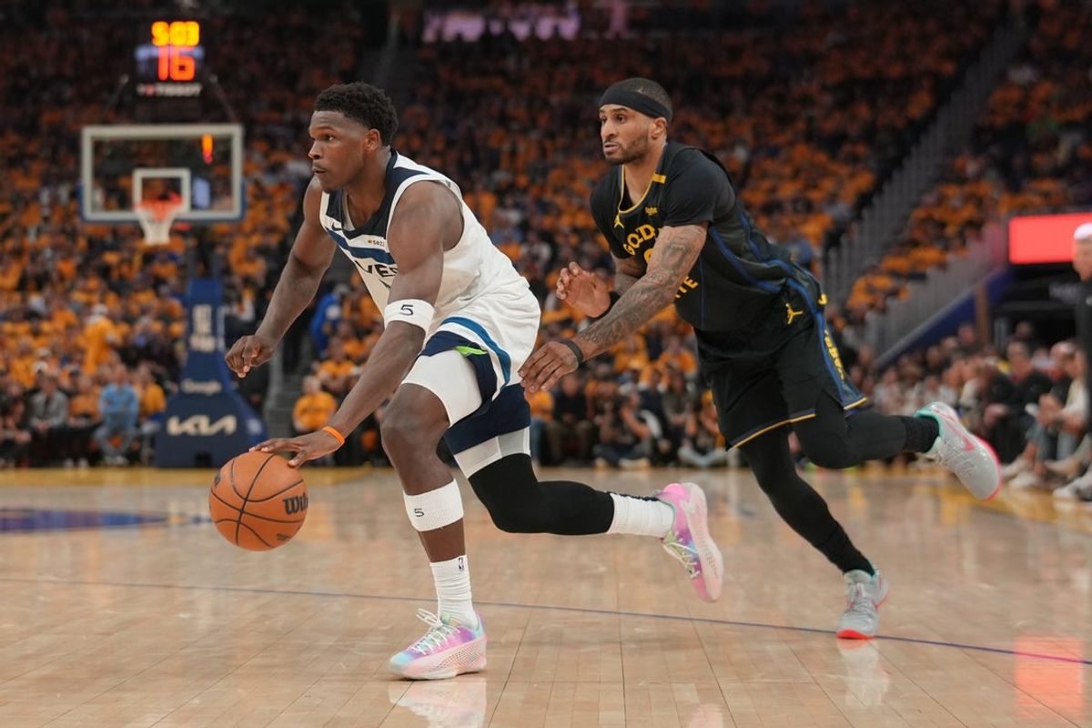 May 12, 2025; San Francisco, California, USA; Minnesota Timberwolves guard Anthony Edwards (5) dribbles past Golden State Warriors guard Gary Payton II (0) in the second quarter during game four of the second round for the 2025 NBA Playoffs at Chase Center. Mandatory Credit: Cary Edmondson-Imagn Images