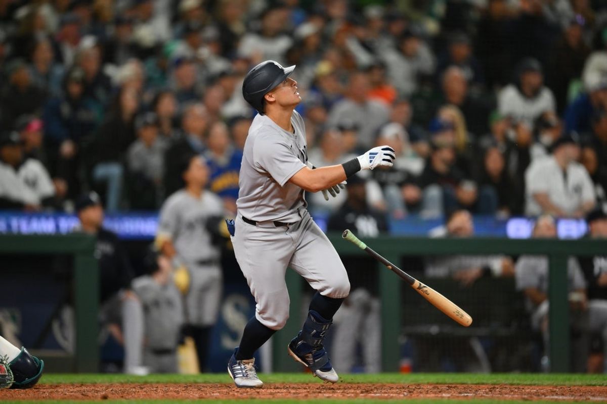 May 12, 2025; Seattle, Washington, USA; New York Yankees shortstop Anthony Volpe (11) hits a home run against the Seattle Mariners during the ninth inning at T-Mobile Park. Mandatory Credit: Steven Bisig-Imagn Images
