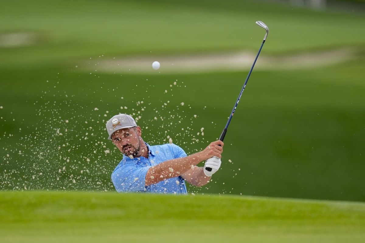 May 13, 2025; Charlotte, North Carolina, USA; Bryson DeChambeau hits out of the bunker on the fifth hole during a practice round for the PGA Championship golf tournament at Quail Hollow. Mandatory Credit: Jim Dedmon-Imagn Images
