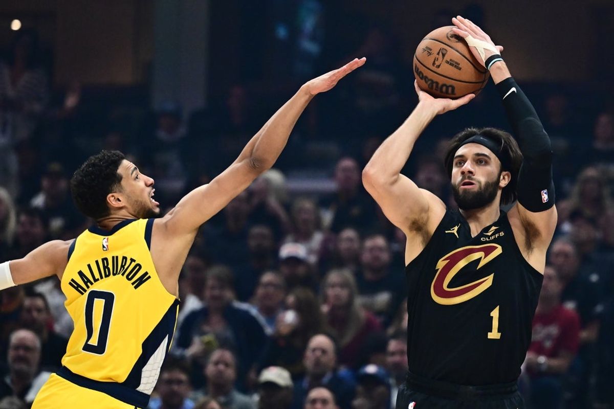 May 13, 2025; Cleveland, Ohio, USA; Cleveland Cavaliers guard Max Strus (1) shoots over the defense of  Indiana Pacers guard Tyrese Haliburton (0) during the first quarter of game five of the second round for the 2025 NBA Playoffs at Rocket Arena. Mandatory Credit: Ken Blaze-Imagn Images