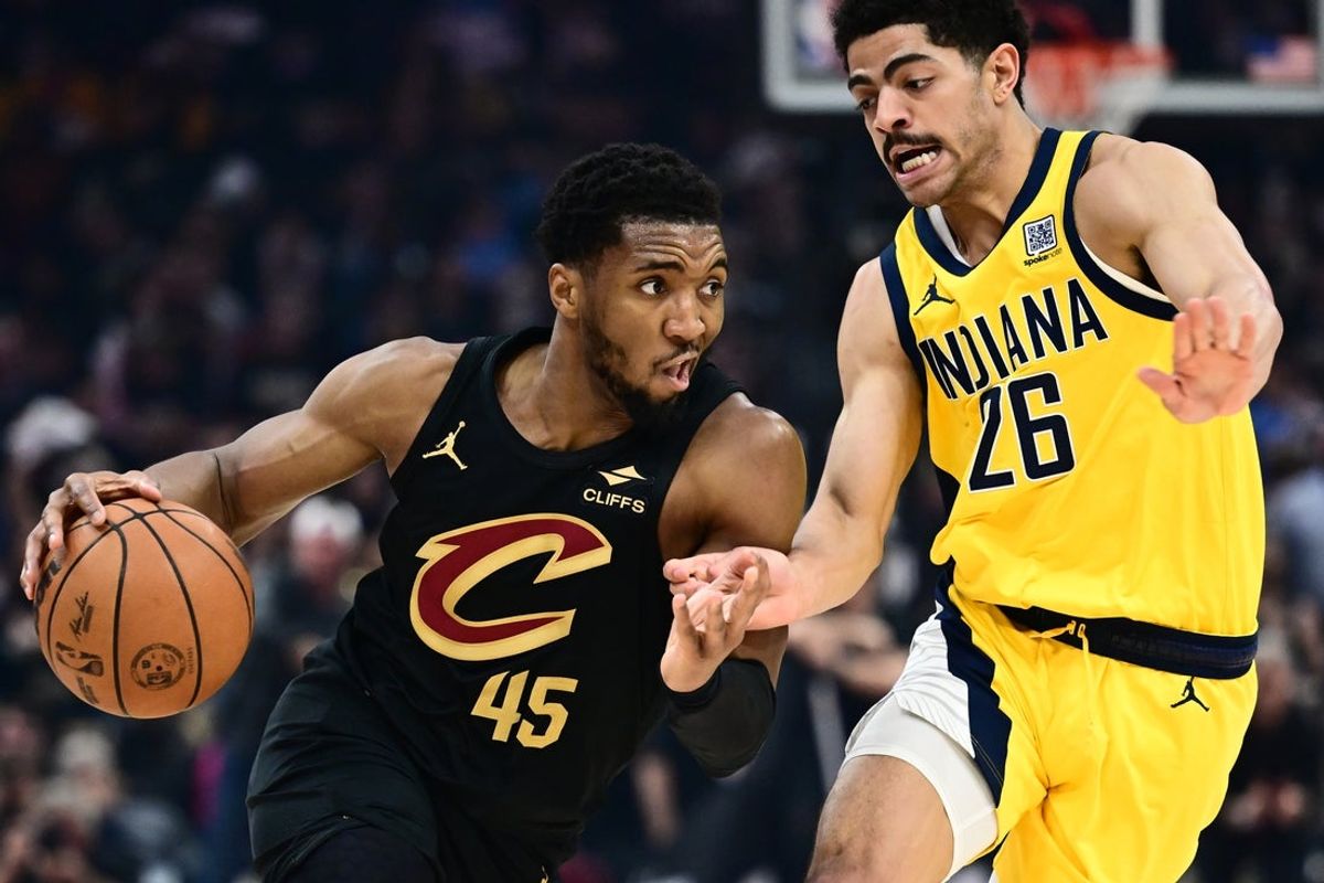 May 13, 2025; Cleveland, Ohio, USA; Cleveland Cavaliers guard Donovan Mitchell (45) drives to the basket against Indiana Pacers guard Ben Sheppard (26) during the first half of game five of the second round for the 2025 NBA Playoffs at Rocket Arena. Mandatory Credit: Ken Blaze-Imagn Images