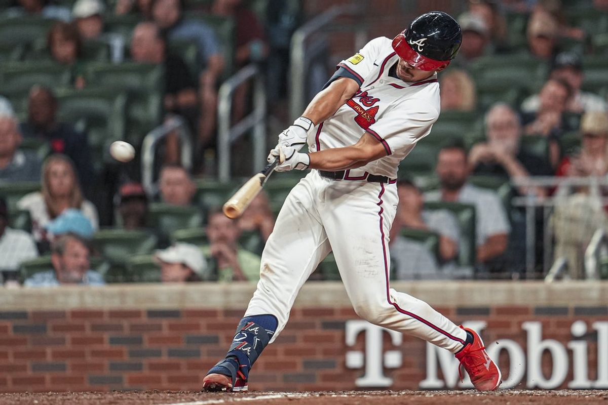 May 13, 2025; Cumberland, Georgia, USA; Atlanta Braves catcher Drake Baldwin (30) hits a double against the Washington Nationals during the eighth inning at Truist Park. Mandatory Credit: Dale Zanine-Imagn Images