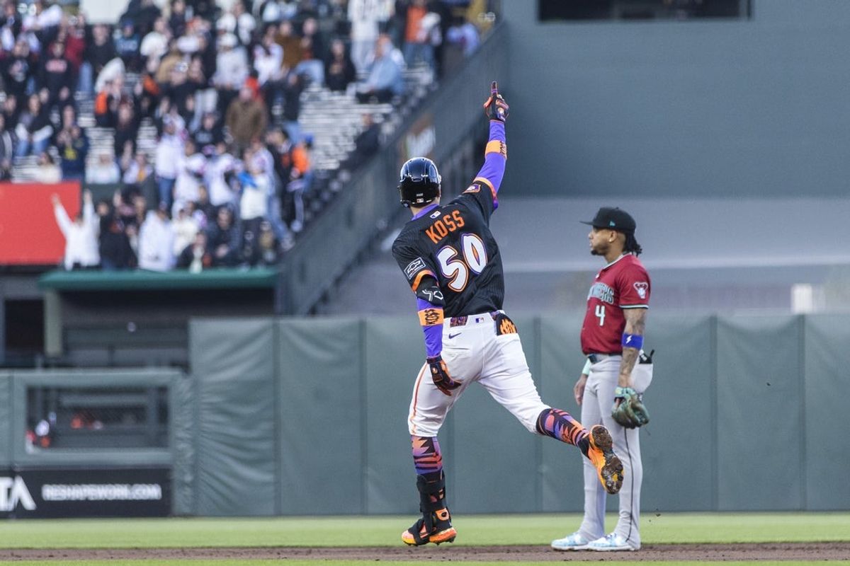 May 13, 2025; San Francisco, California, USA; San Francisco Giants second baseman Christian Koss (50) gestures as he runs the bases after hitting a grand slam against the Arizona Diamondbacks during the second inning at Oracle Park. Mandatory Credit: John Hefti-Imagn Images