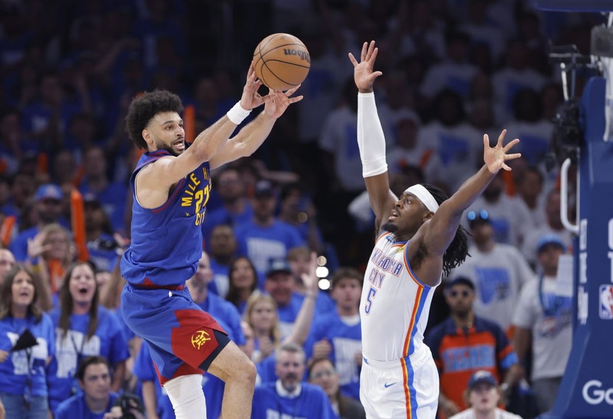 May 13, 2025; Oklahoma City, Oklahoma, USA; Denver Nuggets guard Jamal Murray (27) passes as Oklahoma City Thunder guard Luguentz Dort (5) defends during the second half of game five of the second round for the 2025 NBA Playoffs at Paycom Center. Mandatory Credit: Alonzo Adams-Imagn Images