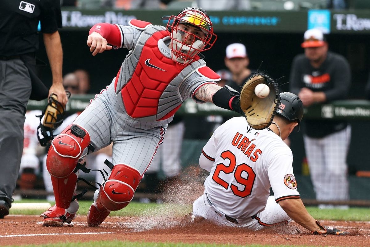 May 14, 2025; Baltimore, Maryland, USA; Baltimore Orioles third baseman Ramon UrÌas (29) scores past Minnesota Twins catcher Christian Vazquez (8) during the third inning at Oriole Park at Camden Yards. Mandatory Credit: Daniel Kucin Jr.-Imagn Images