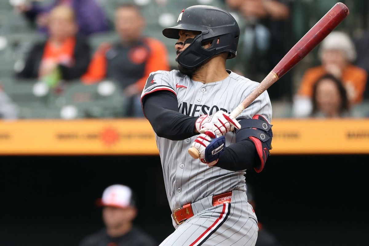 May 14, 2025; Baltimore, Maryland, USA; Minnesota Twins shortstop Carlos Correa (4) hits a single during the eighth inning against the Baltimore Orioles at Oriole Park at Camden Yards. Mandatory Credit: Daniel Kucin Jr.-Imagn Images