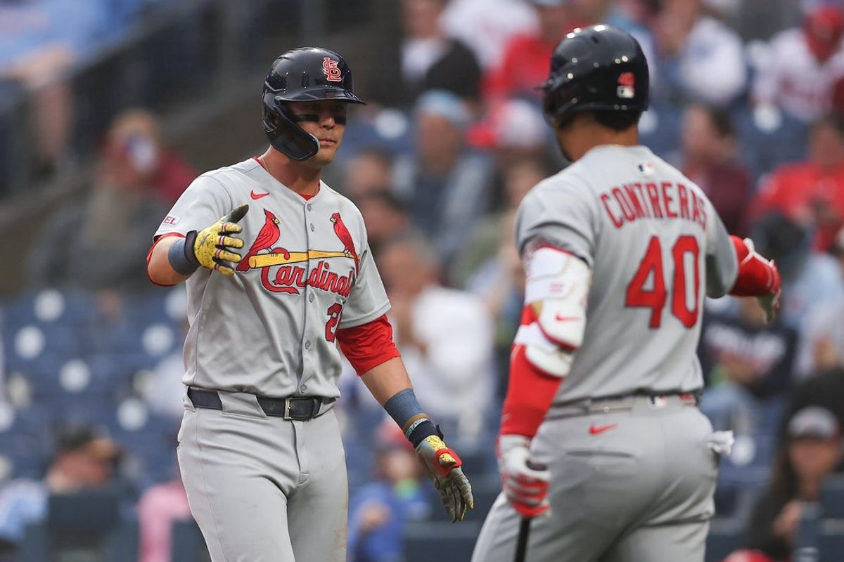 May 14, 2025; Philadelphia, Pennsylvania, USA; St. Louis Cardinals outfielder Lars Nootbaar (21) shakes hands with first base Willson Contreras (40) after scoring during the first inning against the Philadelphia Phillies at Citizens Bank Park. Mandatory Credit: Bill Streicher-Imagn Images