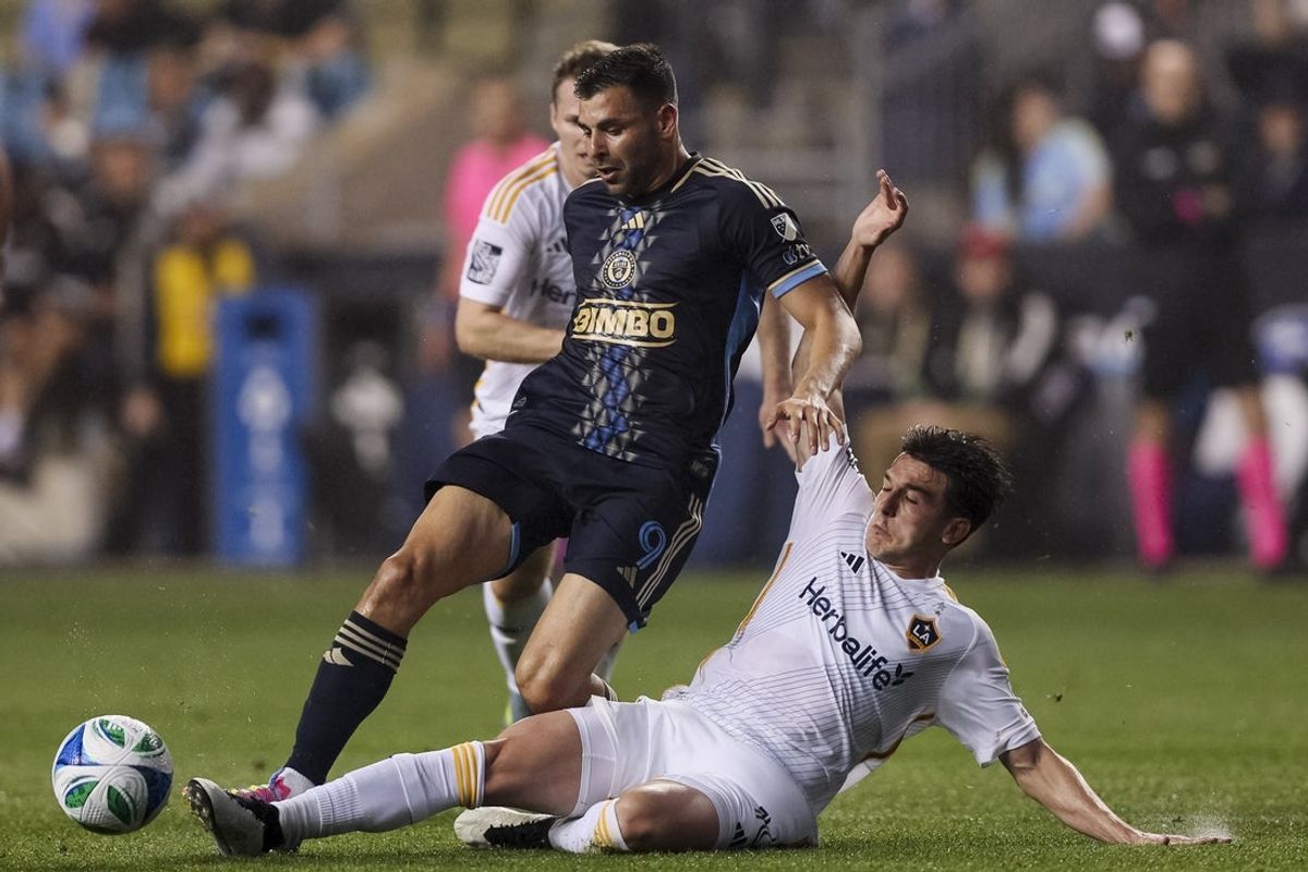 May 14, 2025; Chester, Pennsylvania, USA;  Los Angeles Galaxy midfielder Isaiah Parente (16) wins the ball from Philadelphia Union forward Tai Baribo (9) during the first half at Subaru Park. Mandatory Credit: Caean Couto-Imagn Images