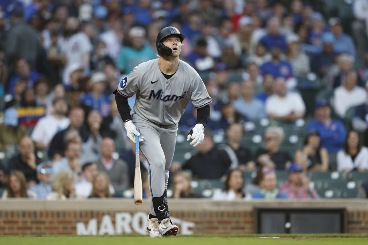 May 14, 2025; Chicago, Illinois, USA; Miami Marlins center fielder Kyle Stowers (28) watches his solo home run against the Chicago Cubs during the fourth inning at Wrigley Field. Mandatory Credit: Kamil Krzaczynski-Imagn Images
