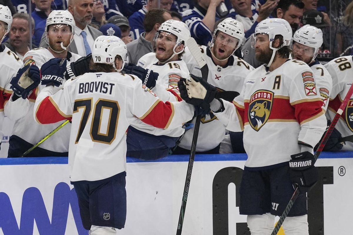 May 14, 2025; Toronto, Ontario, CAN; Florida Panthers defenseman Aaron Ekblad (5) congratulates Florida Panthers forward Jesper Boqvist (70) after his goal against the Toronto Maple Leafs during the second period of game five of the second round of the 2025 Stanley Cup Playoffs at Scotiabank Arena. Mandatory Credit: John E. Sokolowski-Imagn Images