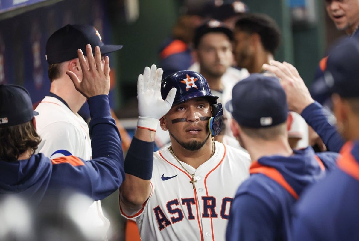 May 14, 2025; Houston, Texas, USA; Houston Astros third baseman Isaac Paredes (15) celebrates his home run with teammates in the dugout after hitting a home run against the Kansas City Royals in the fourth inning at  Daikin Park. Mandatory Credit: Thomas Shea-Imagn Images