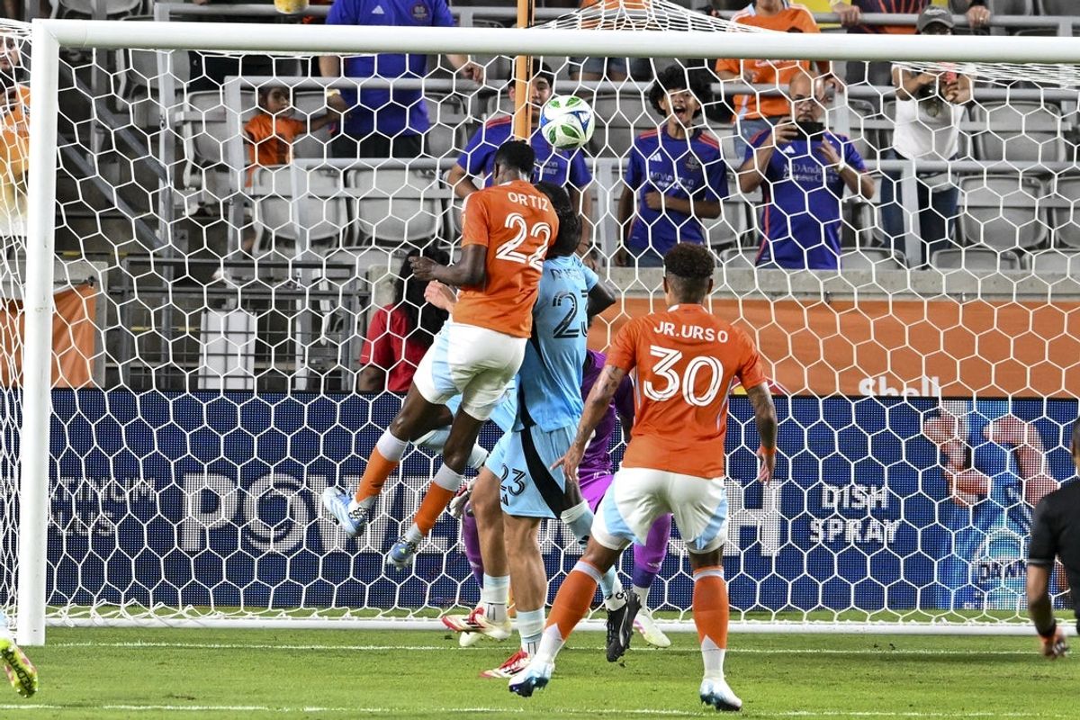 May 14, 2025; Houston, Texas, USA; Houston Dynamo FC defender Pablo Ortiz (22) heads the ball for a goal during the first half against the Minnesota United FC at Shell Energy Stadium. Mandatory Credit: Maria Lysaker-Imagn Images