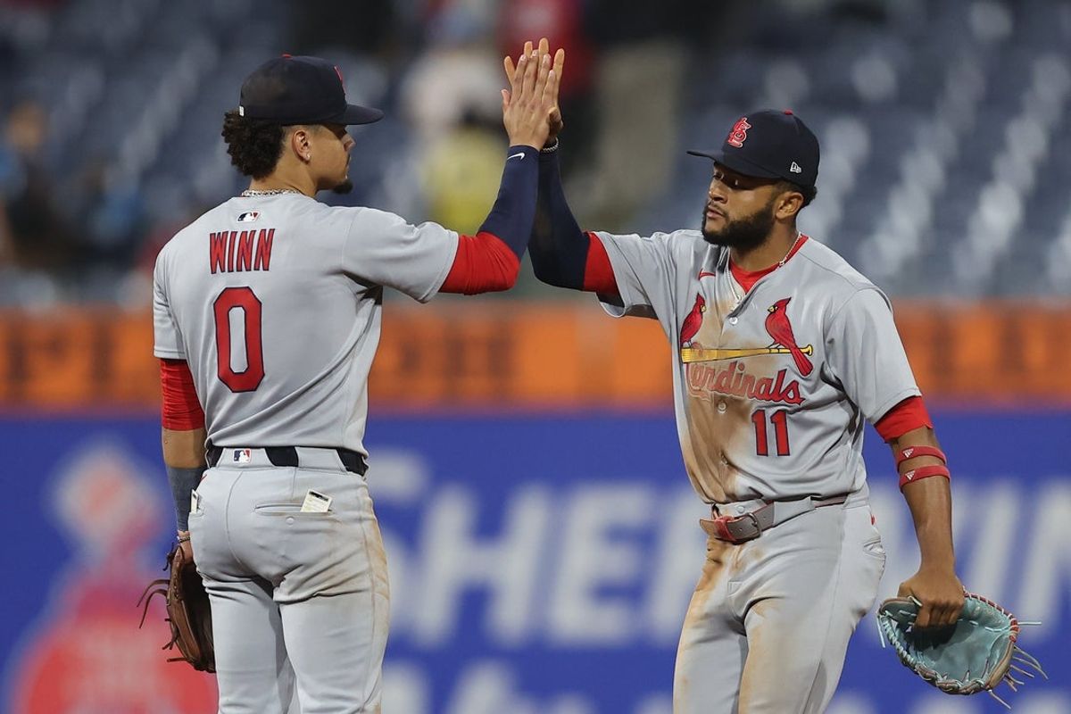 May 14, 2025; Philadelphia, Pennsylvania, USA; St. Louis Cardinals shortstop Masyn Winn (0) and outfielder Victor Scott II (11) high five after a victory against the Philadelphia Phillies at Citizens Bank Park. Mandatory Credit: Bill Streicher-Imagn Images