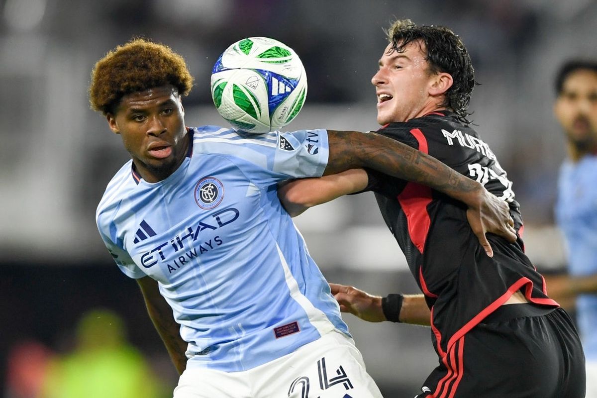 May 14, 2025; Washington, District of Columbia, USA; New York City FC defender Tayvon Gray (24) and D.C. United forward Jacob Murrell (17) go after the ball during the second half of the game at Audi Field. Mandatory Credit: Hannah Foslien-Imagn Images