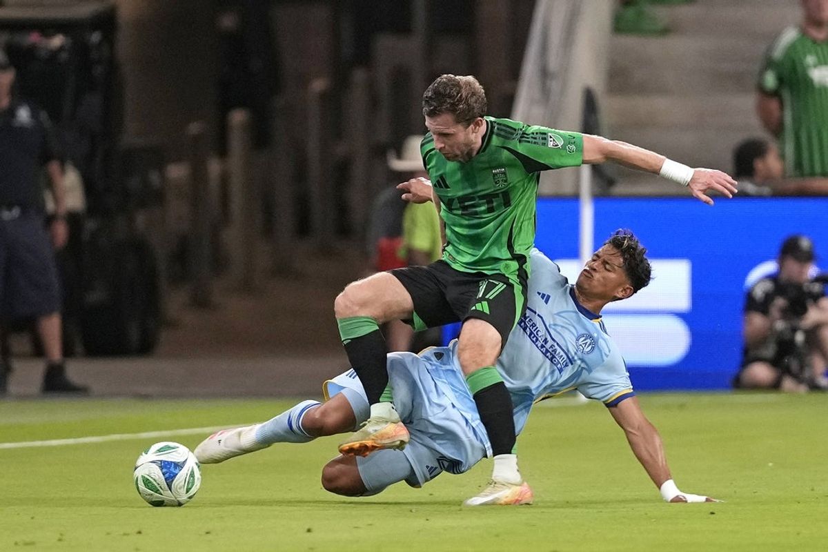 May 14, 2025; Austin, Texas, USA; Austin FC defender Jon Gallagher (17) and Atlanta United FC defender Ronald Hernandez (2) battle for the ball during the first half at Q2 Stadium. Mandatory Credit: Scott Wachter-Imagn Images