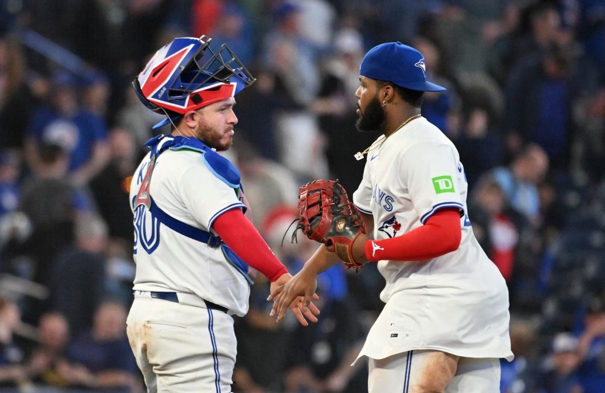 May 14, 2025; Toronto, Ontario, CAN;  Toronto Blue Jays catcher Alejandro Kirk (30) celebraes with first baseman Vladimir Guerrero Jr. (27) after a win over the Tampa Bay Rays at Rogers Centre. Mandatory Credit: Dan Hamilton-Imagn Images