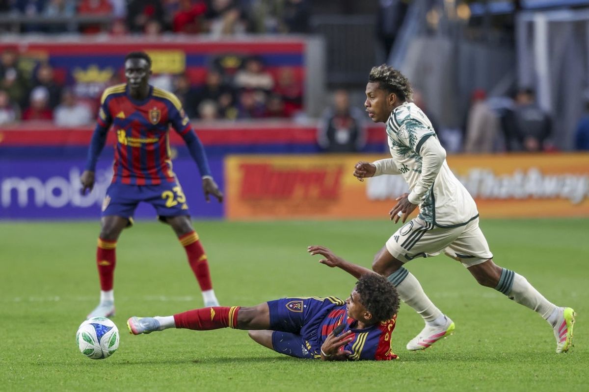 May 14, 2025; Sandy, Utah, USA; Real Salt Lake forward Zavier Gozo (72) kicks the ball away from a Portland Timber defender during the first half at America First Field. Mandatory Credit: Rob Gray-Imagn Images