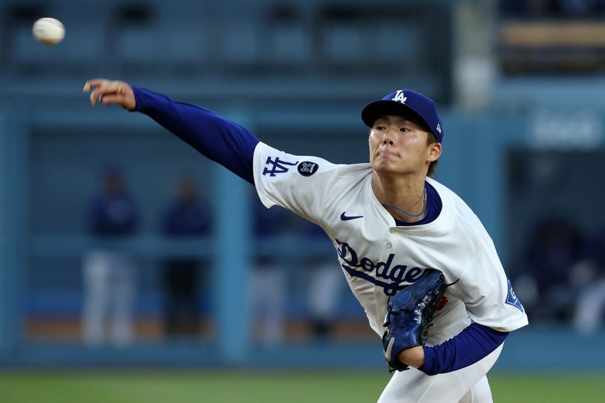 May 14, 2025; Los Angeles, California, USA; Los Angeles Dodgers pitcher Yoshinobu Yamamoto (18) throws a pitch during the second inning at Dodger Stadium. Mandatory Credit: Jason Parkhurst-Imagn Images