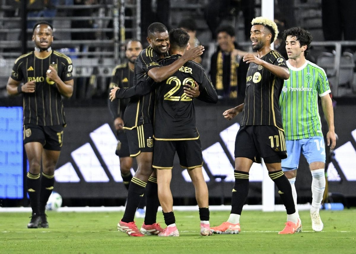 May 14, 2025; Los Angeles, California, USA; Los Angeles FC defender Marlon (5) celebrates a goal by midfielder Cengiz Ünder (22) against the Seattle Sounders during the first half at BMO Stadium. Mandatory Credit: Alex Gallardo-Imagn Images