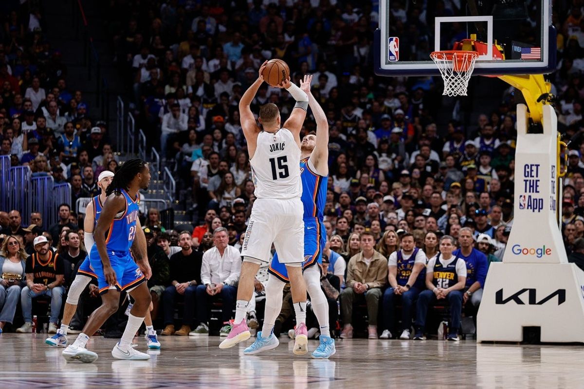 May 15, 2025; Denver, Colorado, USA; Denver Nuggets center Nikola Jokic (15) attempts a shot as Oklahoma City Thunder center Isaiah Hartenstein (55) defends in the second quarter during game six of the second round for the 2025 NBA Playoffs at Ball Arena. Mandatory Credit: Isaiah J. Downing-Imagn Images