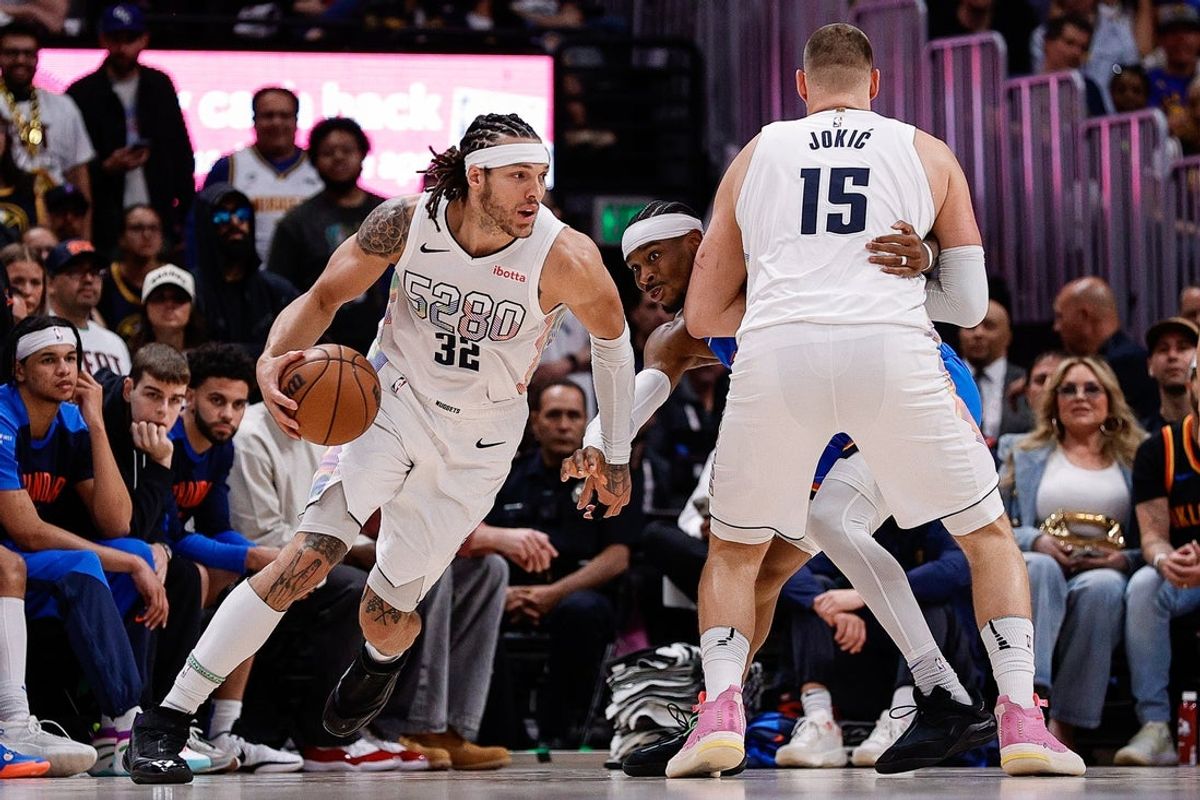 May 15, 2025; Denver, Colorado, USA; Denver Nuggets forward Aaron Gordon (32) controls the ball as center Nikola Jokic (15) screens against Oklahoma City Thunder guard Shai Gilgeous-Alexander (2) in the second quarter during game six of the second round for the 2025 NBA Playoffs at Ball Arena. Mandatory Credit: Isaiah J. Downing-Imagn Images