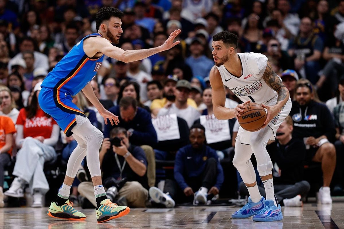 May 15, 2025; Denver, Colorado, USA; Denver Nuggets forward Michael Porter Jr. (1) controls the ball as Oklahoma City Thunder forward Chet Holmgren (7) guards in the second quarter during game six of the second round for the 2025 NBA Playoffs at Ball Arena. Mandatory Credit: Isaiah J. Downing-Imagn Images