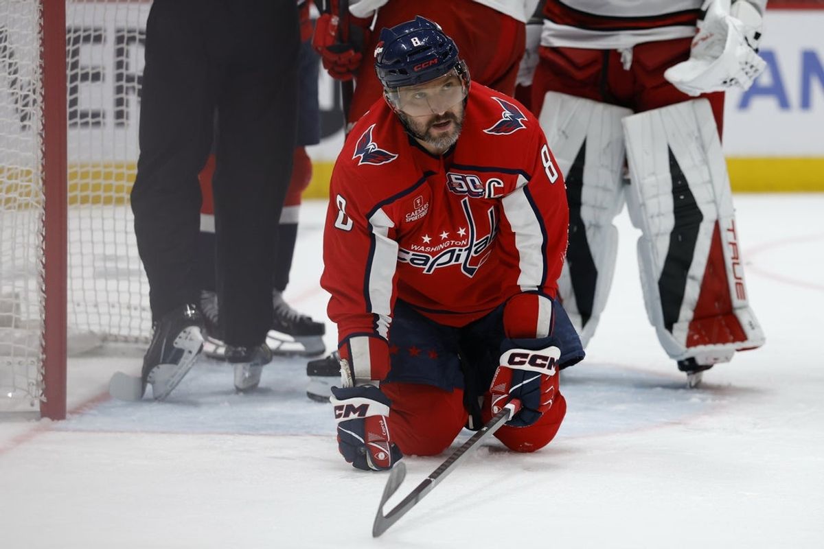May 15, 2025; Washington, District of Columbia, USA; Washington Capitals left wing Alex Ovechkin (8) kneels on the ice after a stoppage in play against the Carolina Hurricanes in the third period in game five of the second round of the 2025 Stanley Cup Playoffs at Capital One Arena. Mandatory Credit: Geoff Burke-Imagn Images