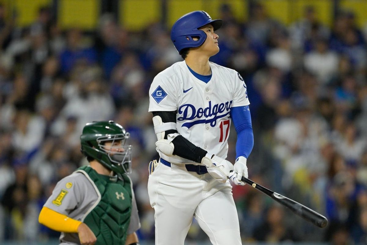 May 15, 2025; Los Angeles, California, USA; Los Angeles Dodgers designated hitter Shohei Ohtani (17) hits a two-run home run against the Athletics during the fourth inning of the game at Dodger Stadium. Mandatory Credit: Jayne Kamin-Oncea-Imagn Images