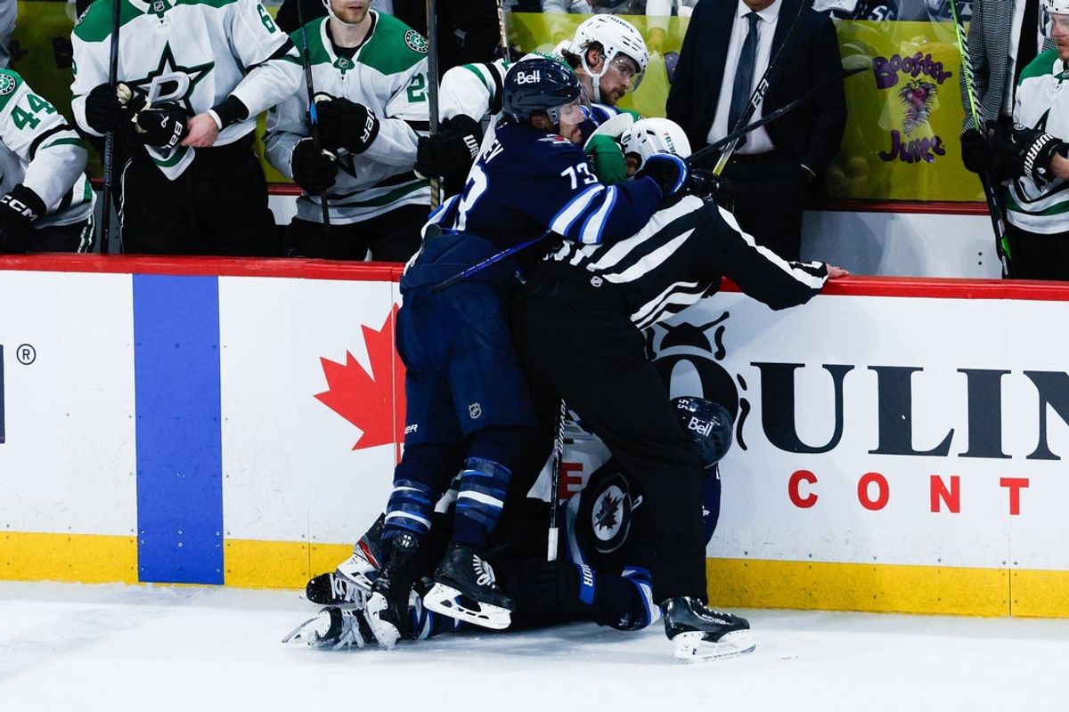 May 15, 2025; Winnipeg, Manitoba, CAN; Winnipeg Jets forward Brandon Tanev (73) jostles with Dallas Stars forward Jamie Benn (14) during the third period in game five of the second round of the 2025 Stanley Cup Playoffs at Canada Life Centre. Mandatory Credit: Terrence Lee-Imagn Images