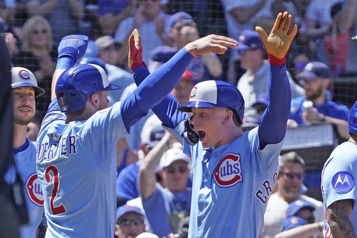 May 16, 2025; Chicago, Illinois, USA; Chicago Cubs outfielder Pete Crow-Armstrong (4) is greeted by second baseman Nico Hoerner (2) after hitting a three run home run against the Chicago White Sox during the second inning at Wrigley Field. Mandatory Credit: David Banks-Imagn Images