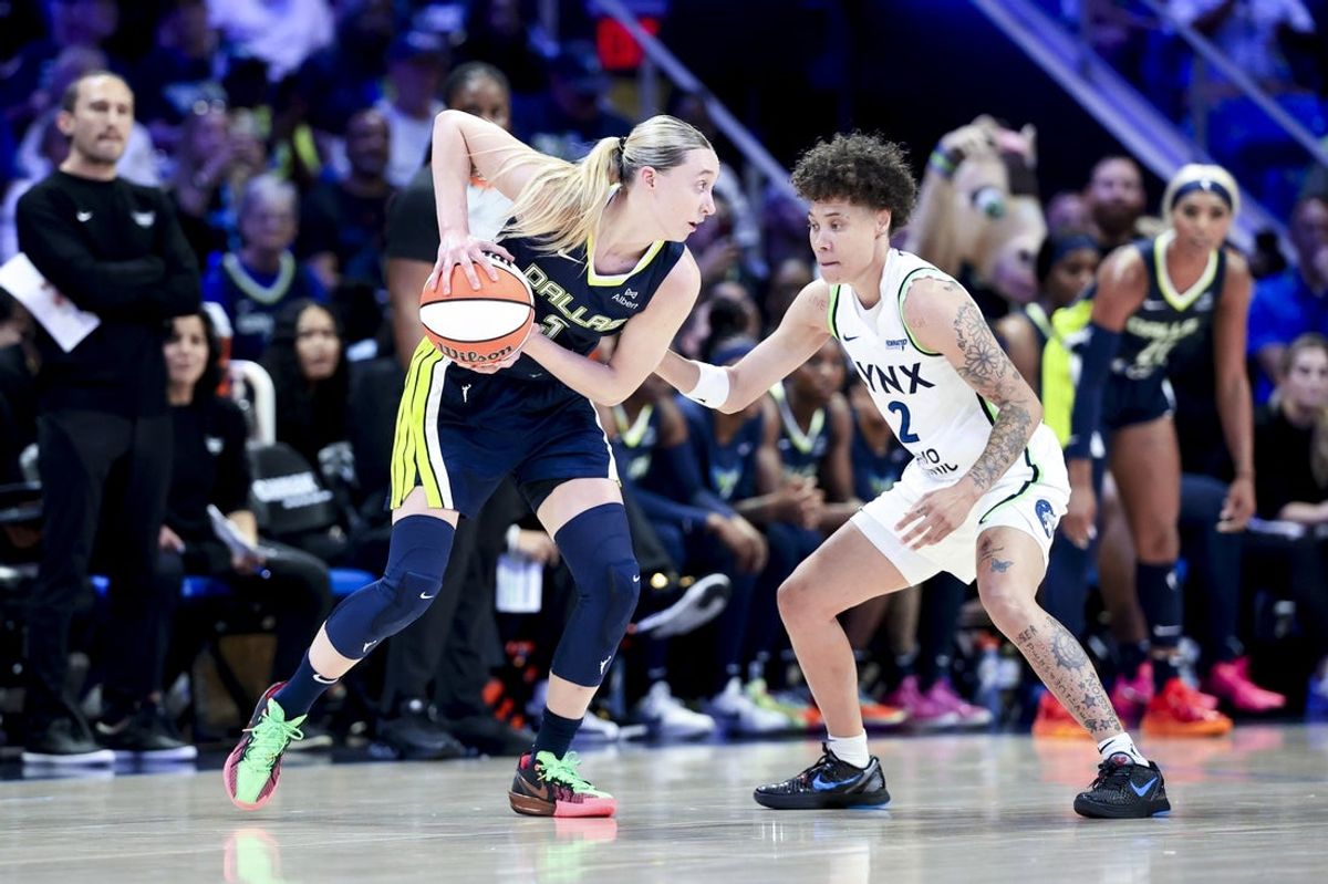May 16, 2025; Arlington, Texas, USA; Dallas Wings guard Paige Bueckers (5) looks to score as Minnesota Lynx guard Natisha Hiedeman (2) defends  during the first half at College Park Center. Mandatory Credit: Kevin Jairaj-Imagn Images